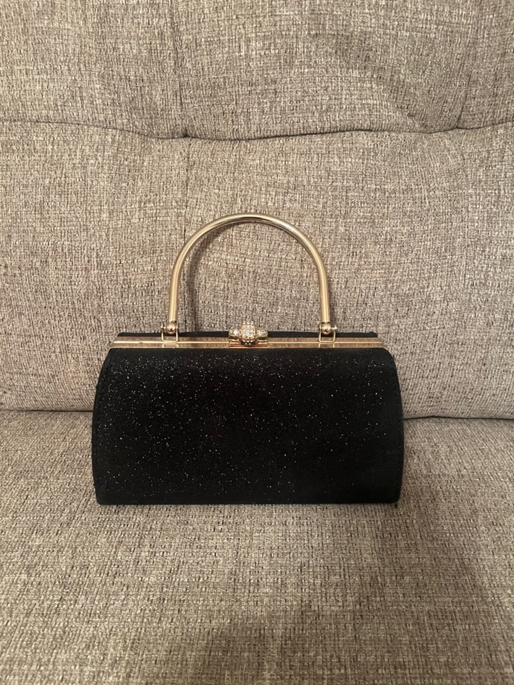 Elegant Black Glitter Evening Handbag with Gold Top Handle, and crossbody chain